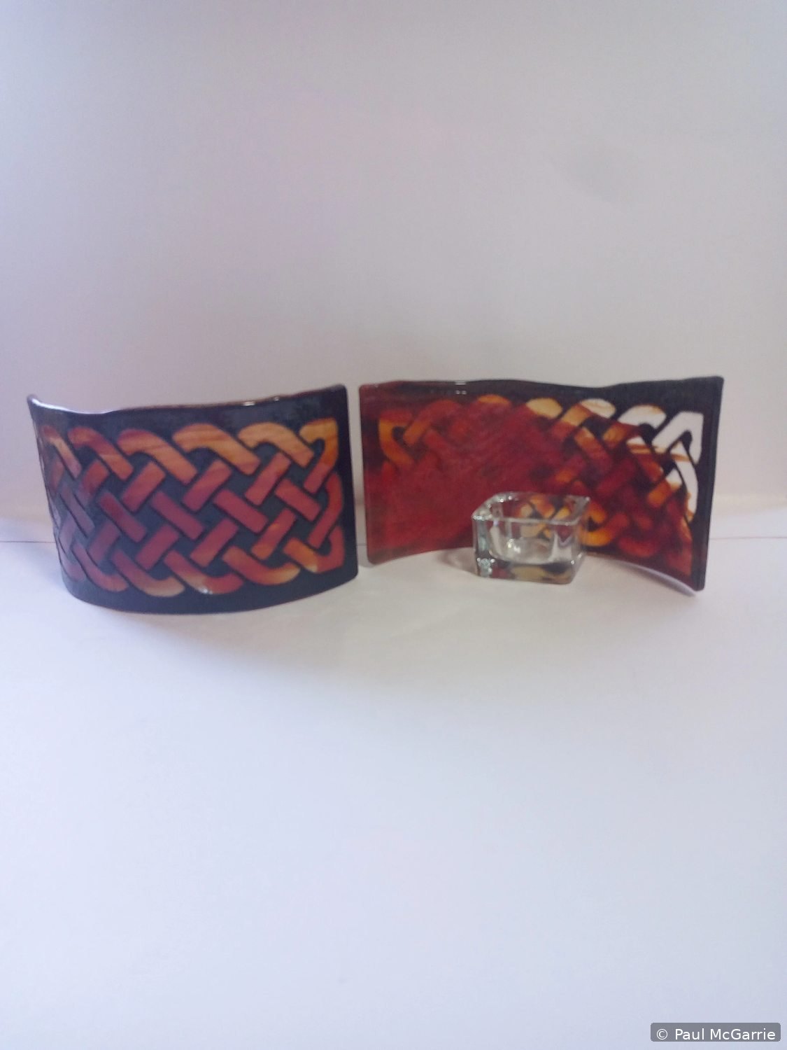 Celtic Knot Holders in Red, fused glass artwork by Paul McGarrie, photograph 1